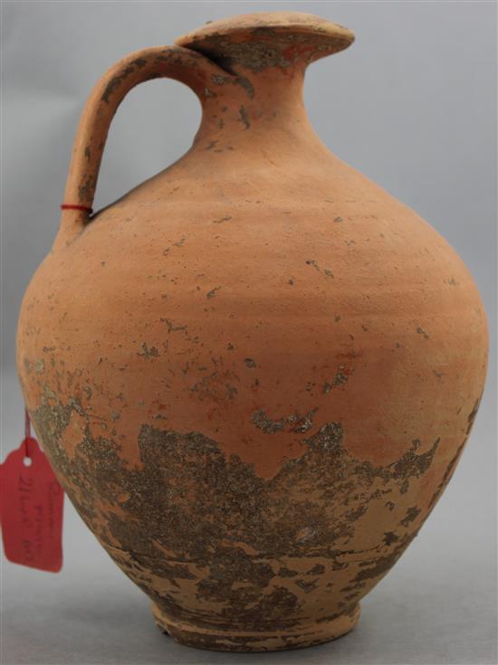 A Roman terracotta flagon, c.2nd century AD, 19cm